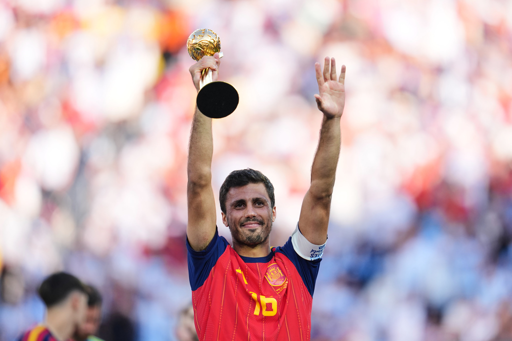 Spain's Rodri celebrates with the tournament's best player award after the World Cup final soccer match between Spain and Argentina in East Rutherford, N.J., near New York, Sunday, July 19, 2026. (AP Photo/Abbie Parr)