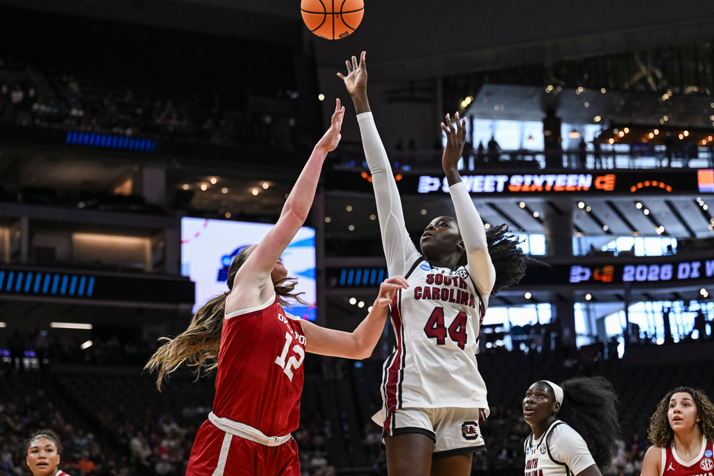 South Carolina guard Agot Makeer (44) shoots over Oklahoma guard Payton Verhulst (12) during the first half in the Sweet 16 of the NCAA college basketball tournament Saturday, March 28, 2026, in Sacramento, Calif. (AP Photo/Justine Willard)