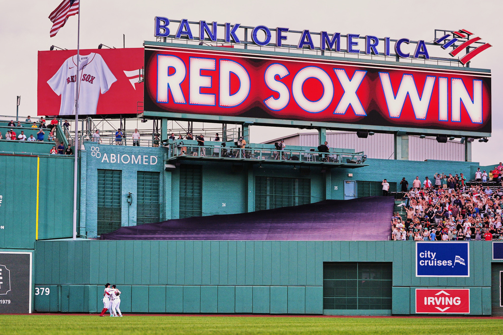 Boston Red Sox outfielders celebrate after defeating the Baltimore Orioles in the first baseball game of a doubleheader, Wednesday, July 22, 2026, in Boston. (AP Photo/Charles Krupa)
