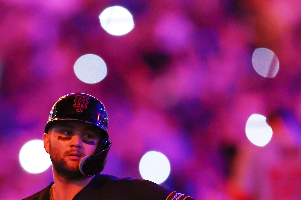 New York Mets' Bo Bichette looks on during a pitching change in the sixth inning of a baseball game against the Washington Nationals, Friday, Aug. 14, 2026, in New York. (AP Photo/Heather Khalifa)