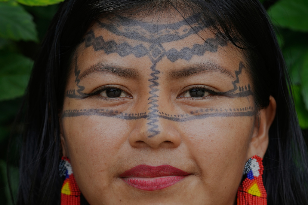 Tamya Dahua, from the Indigenous Kichwa community, poses for a photo in Nueva Loja, Ecuador, Saturday , March 7, 2026. (AP Photo/Dolores Ochoa).