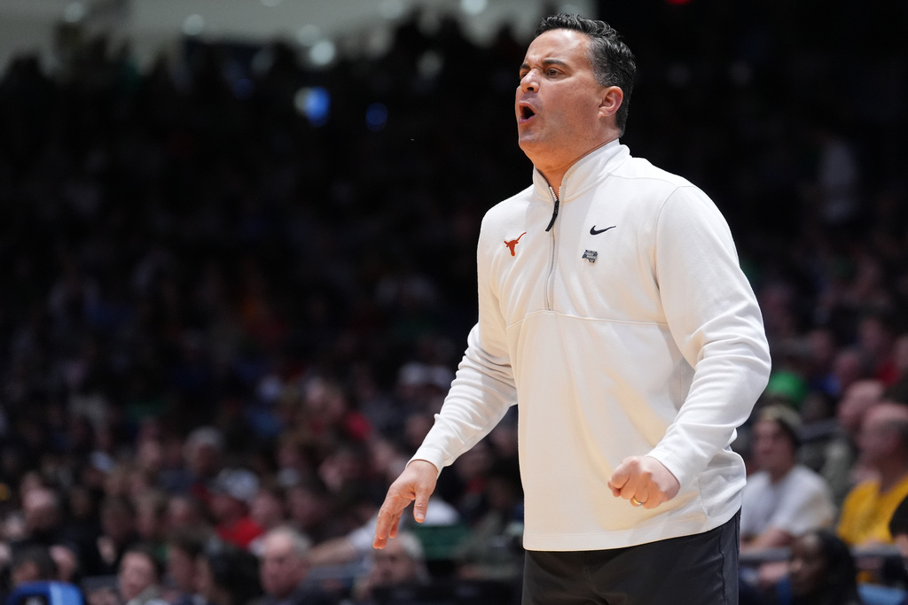 Texas head coach Sean Miller instructs the team during the first half in a First Four college basketball game in the NCAA Tournament against North Carolina State, Tuesday, March 17, 2026, in Dayton, Ohio. (AP Photo/Kareem Elgazzar)