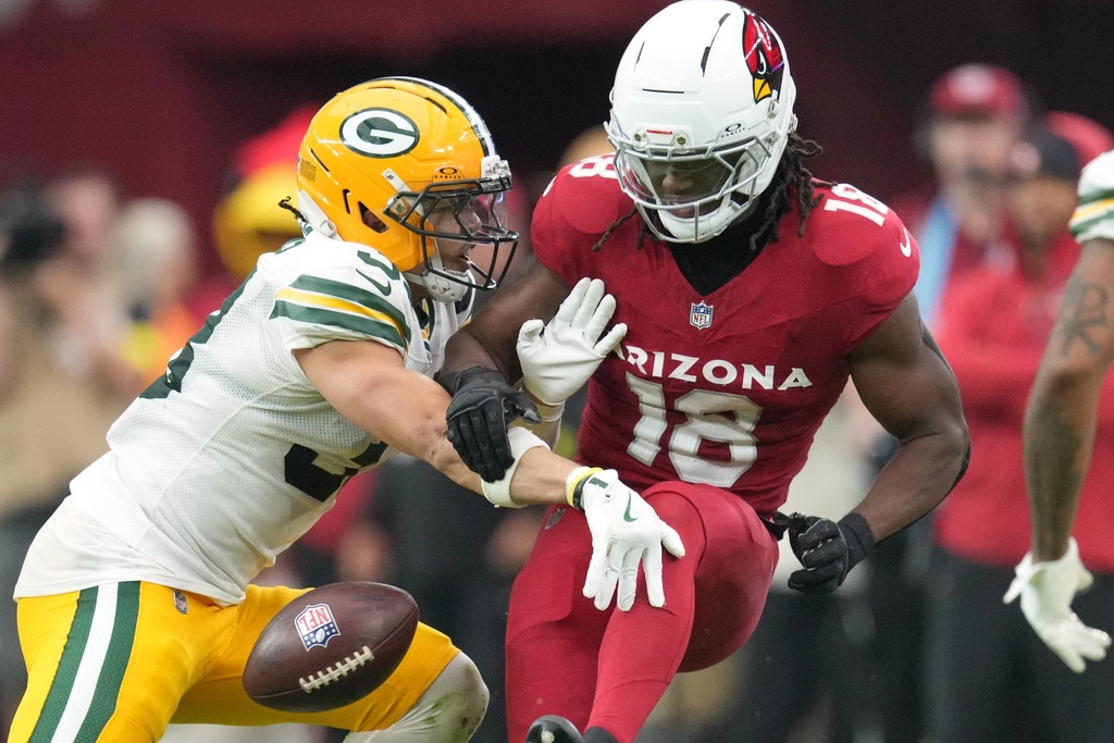 Green Bay Packers' Evan Williams is called for pass interference on Arizona Cardinals' Marvin Harrison Jr. during the second half of an NFL football game Sunday, Oct. 19, 2025, in Glendale, Ariz. (AP Photo/Ross D. Franklin)