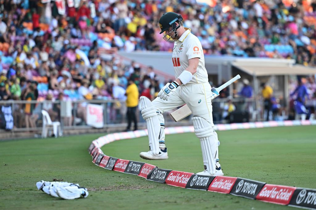 Steve Smith of Australia exits the field after being caught and bowled by Mehidy Hasan Miraz of Bangladesh during play on day three of the first cricket test in Darwin, Australia, Saturday, Aug.15, 2026. (James Ross/AAPImage via AP)