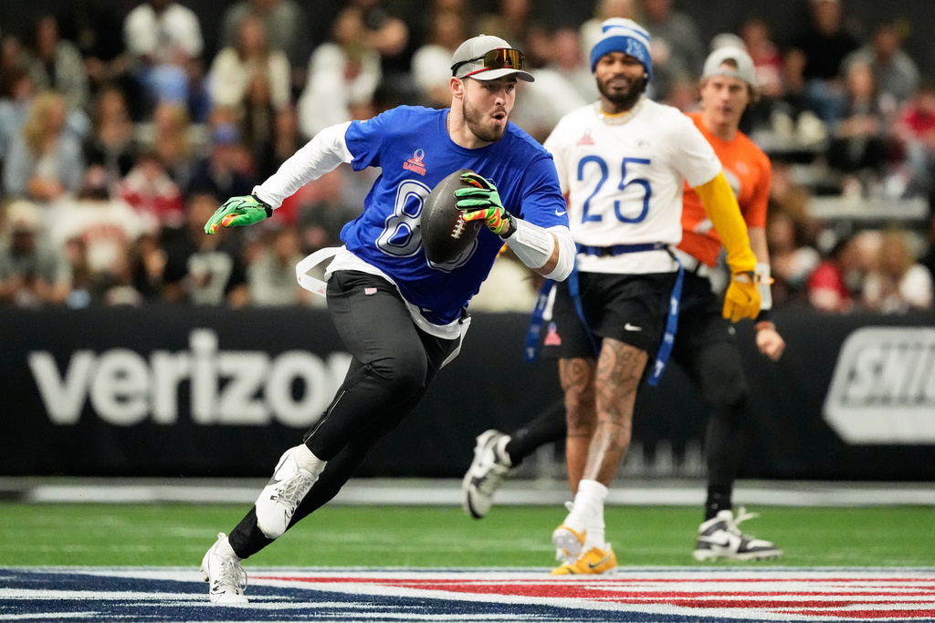 AFC tight end Dalton Kincaid, left, of the Buffalo Bills, runs against NFC cornerback Keisean Nixon (25), of the Green Bay Packers, during the first half of the NFL Pro Bowl football game in San Francisco, Tuesday, Feb. 3, 2026. (AP Photo/Jeff Chiu)