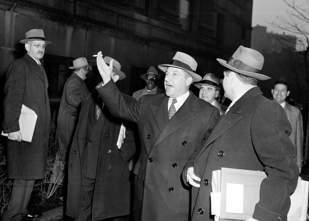 FILE - Gambler Frank Costello waves as he leaves federal courthouse in New York, Jan. 15, 1952. (AP Photo/File)