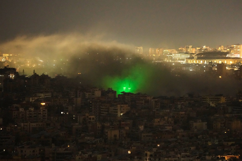 Smoke rises from the site of an Israeli airstrike in Dahiyeh, Beirut's southern suburbs, Monday, March 23, 2026. (AP Photo/Hassan Ammar)
