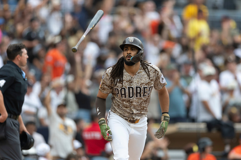 San Diego Padres' Fernando Tatis Jr. tosses his bat after hitting a home run during the fourth inning of a baseball game against the Houston Astros, Sunday, Aug. 9, 2026, in San Diego. (AP Photo/Karl Anderson)