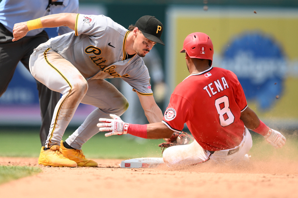 Washington Nationals' Jose Tena (8) is out against Pittsburgh Pirates shortstop Konnor Griffin, front left, while attempting to steal second base during the sixth inning of a baseball game, Sunday, July 5, 2026, in Washington. (AP Photo/Nick Wass)