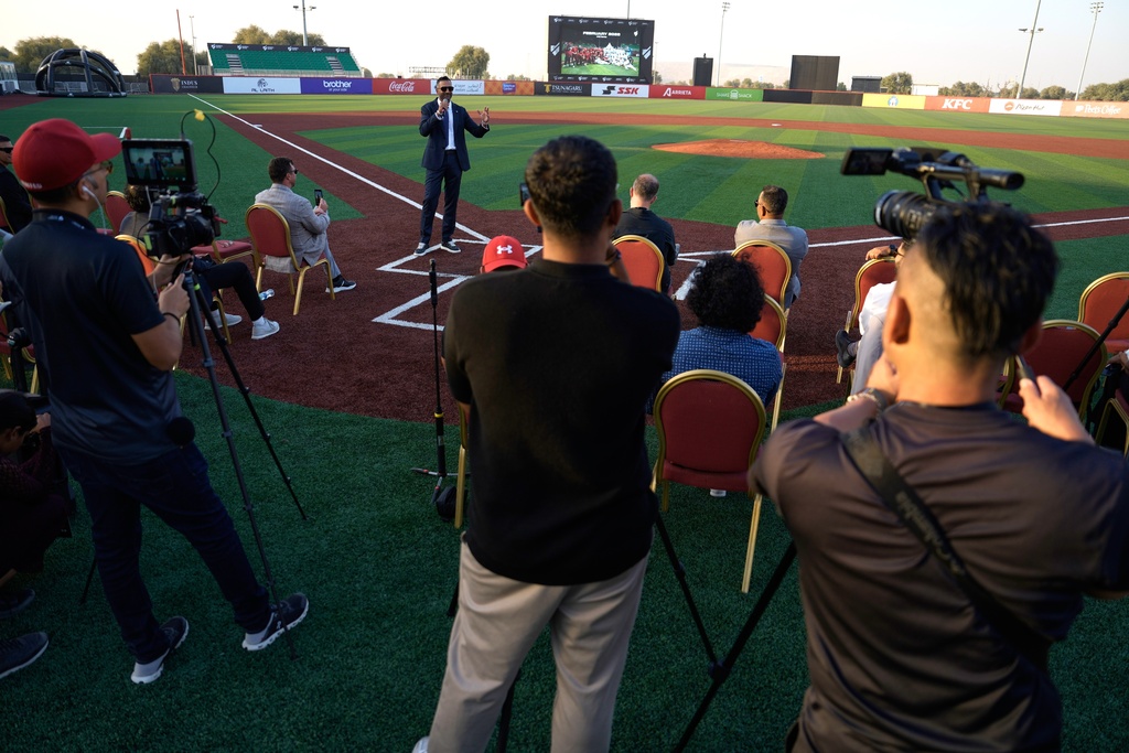 Baseball United CEO and co-founder Kash Shaikh speaks to journalists ahead of the league's inaugural season at the new Barry Larkin Field in Ud al-Bayda outside of Dubai, United Arab Emirates, Thursday, Nov. 13, 2025. (AP Photo/Fatima Shbair)