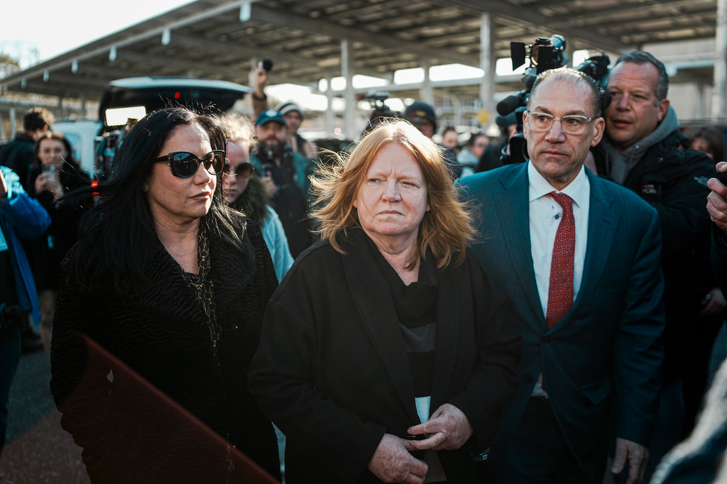 Asa Ellerup, left, wife, of Rex Heuermann and Ellerup's attorney, Robert Macedonio, right arrive outside court as Rex Heuermann, accused in Long Island's infamous Gilgo Beach serial killings, is expected to plead guilty, Wednesday, April 8, 2026, at Suffolk County Court in Riverhead, N.Y. (AP Photo/Eduardo Munoz Alvarez)