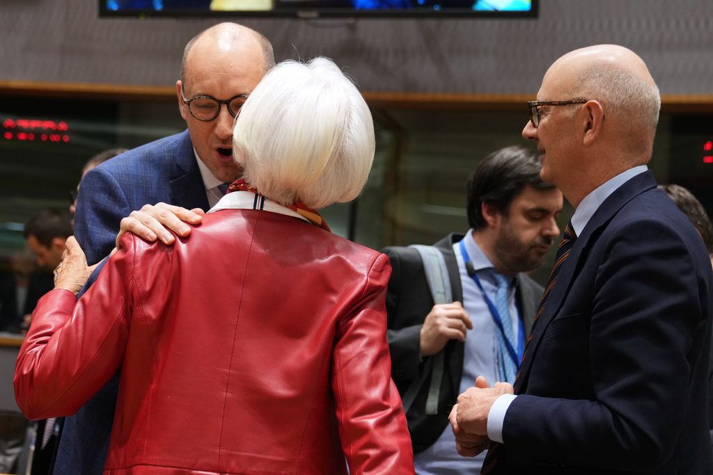 Belgium's Finance Minister Vincent Van Peteghem, left, speaks with European Central Bank President Christine Lagarde, center, and French Finance Minister Roland Lescure during a meeting of eurozone finance ministers at the EU Council building in Brussels, Thursday, Dec. 11, 2025. (AP Photo/Virginia Mayo)