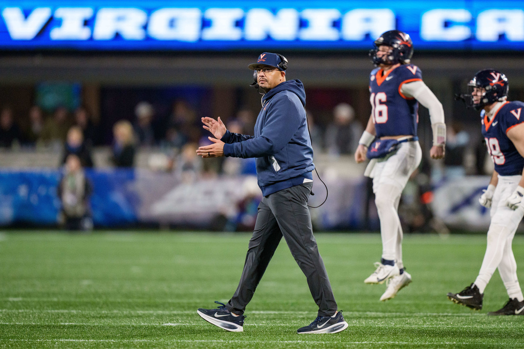 FILE - Virginia head coach Tony Elliott looks on during the Atlantic Coast Conference championship NCAA college football game between Virginia and Duke, Saturday, Dec. 6, 2025, in Charlotte, N.C. (AP Photo/Jacob Kupferman, File(