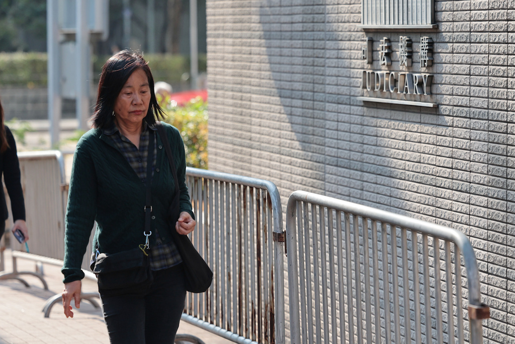 Chan Po-ying, wife of Leung Kwok-hung, one of the defendants in the national security case and the former chairperson of the now-disbanded League of Social Democrats arrives at the West Kowloon Law Courts Building ahead of the national security appeal cases, in Hong Kong, Monday, Feb. 23, 2026. (AP Photo/May James)