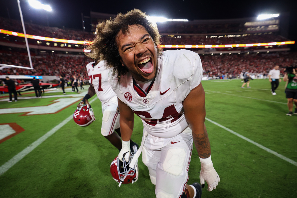 Alabama offensive lineman Michael Carroll (64) reacts after an NCAA college football game against Georgia, Saturday, Sept. 27, 2025, in Athens, Ga. (AP Photo/Colin Hubbard)