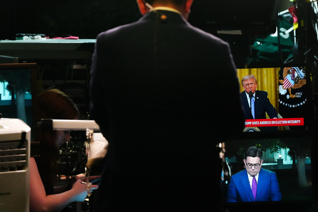 CBS News correspondent Ed O'Keefe prepares to film a stand-up as President Donald Trump speaks from the East Room of the White House, Thursday, July 16, 2026, in Washington. (AP Photo/Julia Demaree Nikhinson)