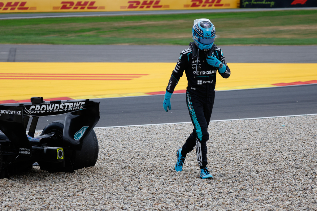 Mercedes driver George Russell of Britain gets out of his car after going off the track during the Formula One Grand Prix at the Spa-Francorchamps racetrack in Spa, Belgium, Sunday, July 19, 2026. (AP Photo/Geert Vanden Wijngaert)