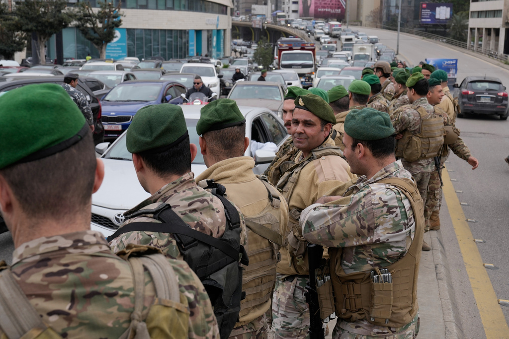 Lebanese army soldiers deploy after taxi drivers block a main highway with their cars during a protest against the increased taxes and gasoline prices issued by the Lebanese Cabinet on Monday, in Beirut, Lebanon, Tuesday, Feb. 17, 2026. (AP Photo/Hussein Malla)