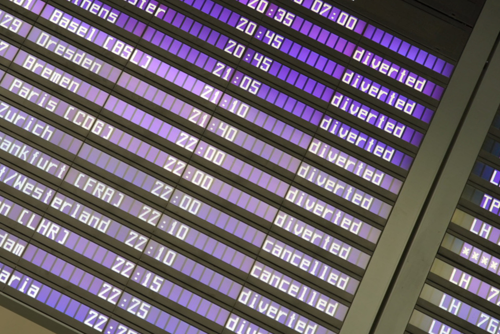 Screens at the Munich Airport show diverted and canceled flights after the airport suspended operations due to possible new drone sightings Friday, Oct. 3, 2025, in Munich. (Enrique Kaczor/dpa via AP)