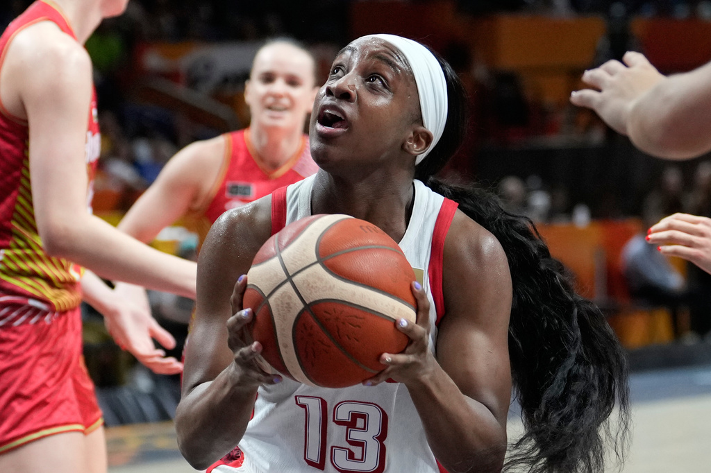 Jackie Young, of the United States, goes for a shot during the Women's Basketball World Cup quarterfinal match between the United States and Hungary in Berlin, Thursday, Sept. 10, 2026. (AP Photo/Ebrahim Noroozi)