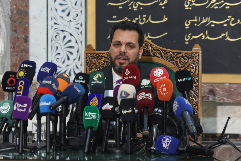 The head of Syria's electoral committee, Mohammed Taha al-Ahmad, speaks during a press conference in Damascus, Syria, Wednesday, July 1, 2026. (AP Photo/Ghaith Alsayed)