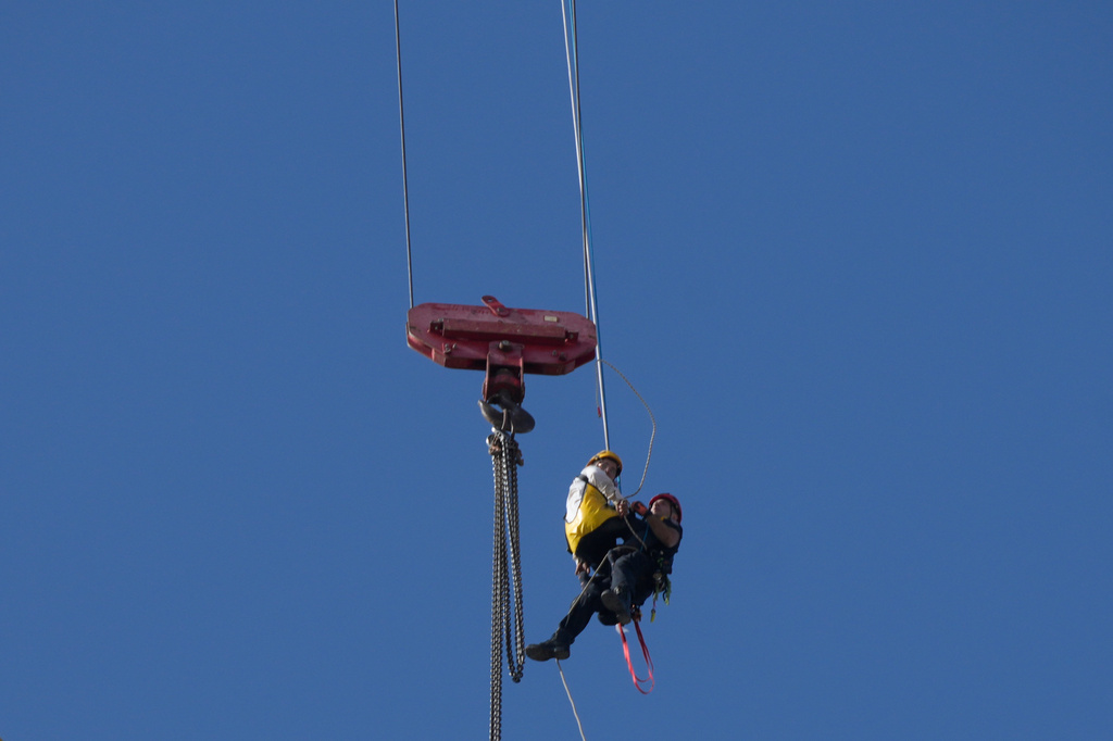 A teenager is rescued from a crane platform atop a skyscraper, where he dangled 36 stories up in the air for seven hours, in Jerusalem Monday, Nov. 24, 2025. (AP Photo/Ohad Zwigenberg)