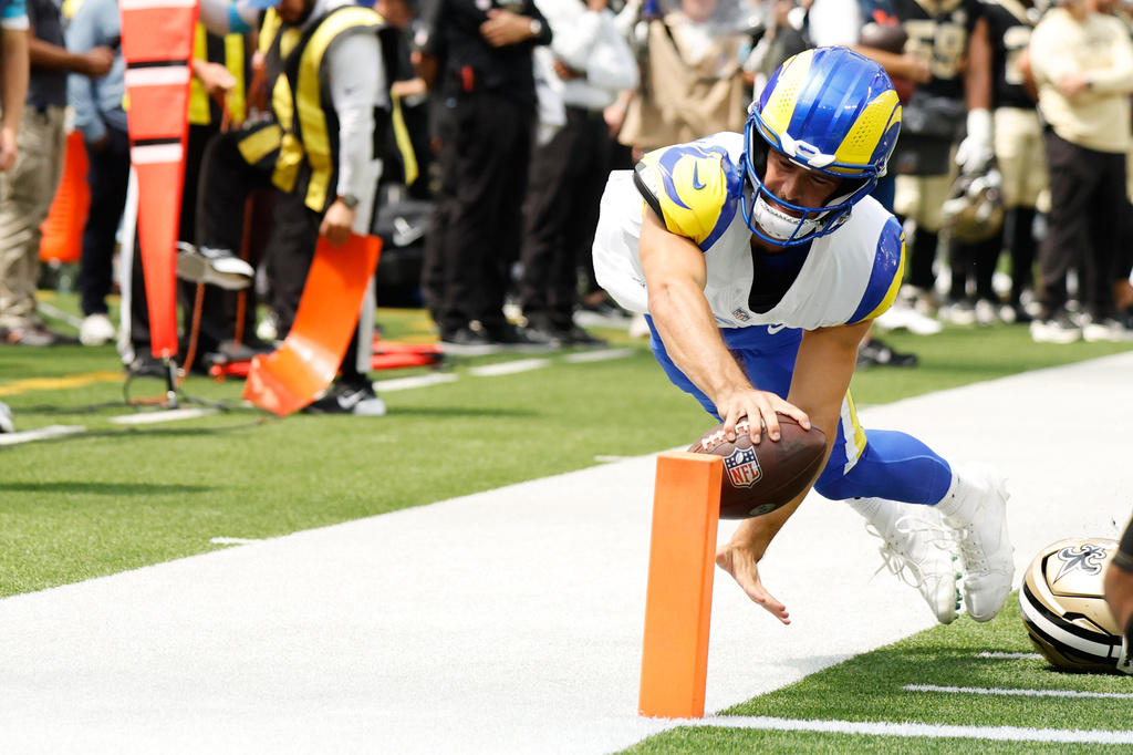 Los Angeles Rams quarterback Stetson Bennett reaches out to touch the pylon to score a touchdown during the first half an NFL preseason football game against the New Orleans Saints Saturday, Aug. 22, 2026, in Inglewood, Calif. (AP Photo/Caroline Brehman)