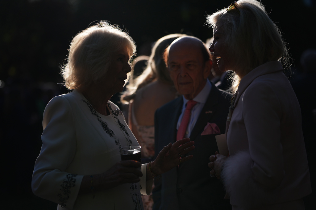 Britain's Queen Camilla speaks with guests during a garden party at the British Embassy, Monday, April 27, 2026, in Washington. (AP Photo/Julia Demaree Nikhinson, Pool)