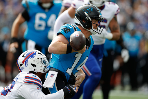 Buffalo Bills defensive end Greg Rousseau (50) forces a fumble by Carolina Panthers quarterback Andy Dalton (14) during the first half an NFL football game, Sunday, Oct. 26, 2025, in Charlotte, N.C. (AP Photo/Rusty Jones) Buffalo Bills defensive end Greg Rousseau (50) forces a fumble by Carolina Panthers quarterback Andy Dalton (14) during the first half an NFL football game, Sunday, Oct. 26, 2025, in Charlotte, N.C. (AP Photo/Rusty Jones)