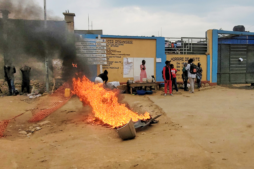 Rubble set on fire as health workers involved in Congo's Ebola response go on strike as they protest over payment issues in Bunia, Congo, Wednesday, July 15, 2026. (AP Photo/Constant Same Bagalwa)