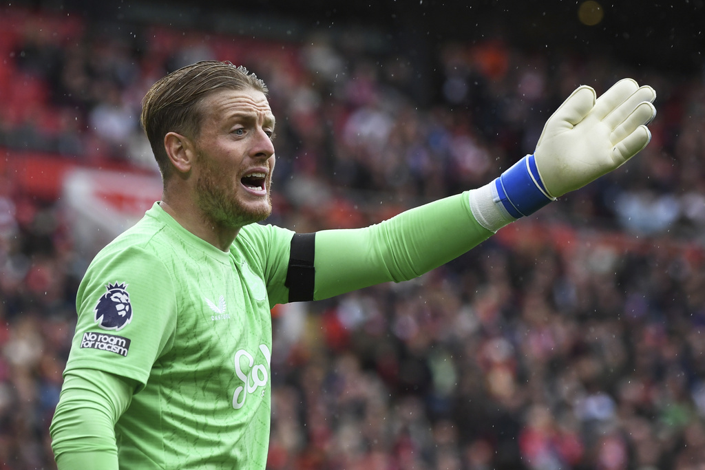 Everton's goalkeeper Jordan Pickford gestures during the English Premier League soccer match between Liverpool and Everton at Anfield stadium in Liverpool, England, Saturday, Sept. 20, 2025. (AP Photo/Rui Vieira)