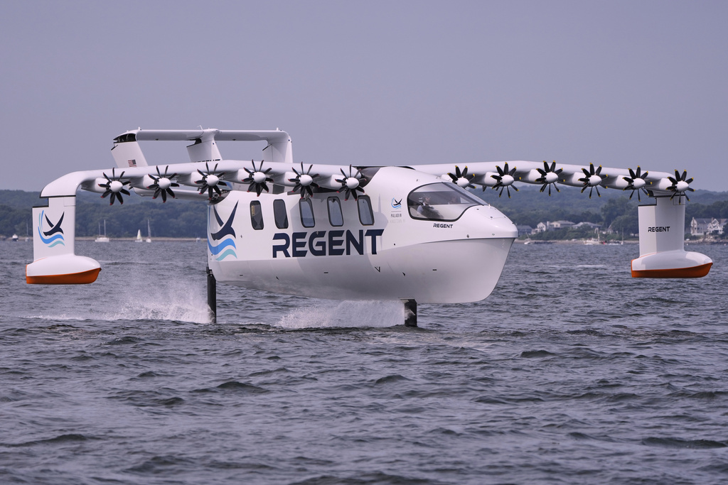 The REGENT Viceroy Seaglider, a winged passenger ferry, glides over the surface of Narragansett Bay on a test run, Wednesday, Aug. 6, 2025, off the coast of North Kingstown, R.I. (AP Photo/Charles Krupa)