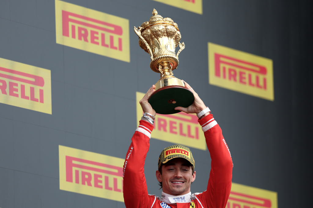 Ferrari driver Charles Leclerc of Monaco celebrates on the podium after winning the British F1 Grand Prix, in Silverstone, England, Sunday, July 5, 2026. (AP Photo/Morgan Harlow)
