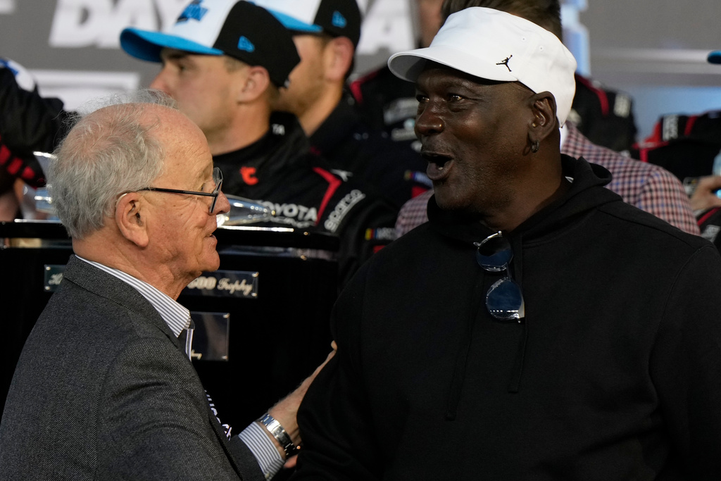 23XI Racing owner Michael Jordan speaks with CEO and Chairman of NASCAR, Jim Frantz after Tyler Reddick won the NASCAR Daytona 500 auto race at Daytona International Speedway, Sunday, Feb. 15, 2026, in Daytona Beach, Fla. (AP Photo/Nigel Cook)