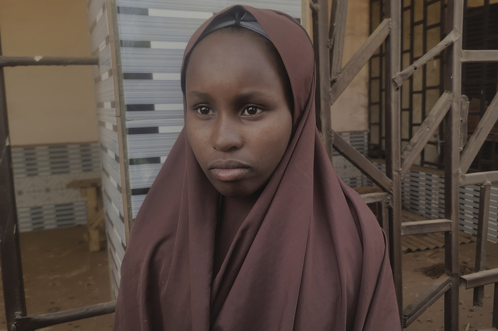 Hawau Usman, a 15 year-old student who was kidnapped by gunmen Monday from the Government Girls Comprehensive Secondary School and managed to escape, is interviewed, in Kebbi, Nigeria, Tuesday, Nov. 18, 2025. (AP Photo/Tunde Omolehin)