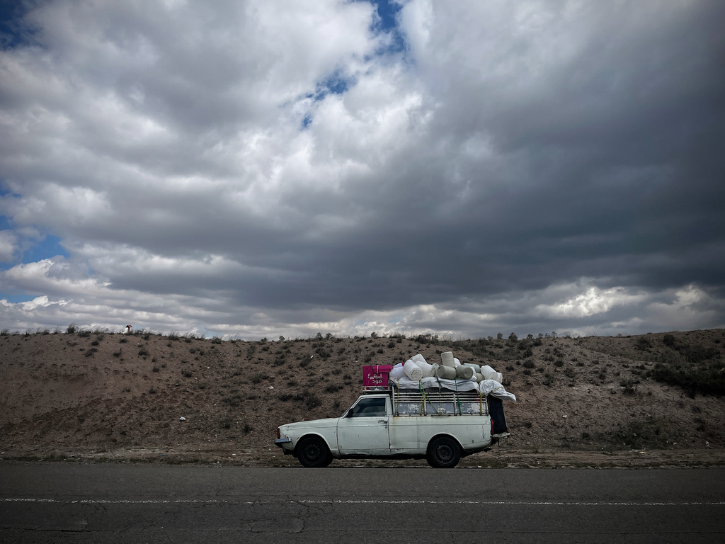 A pickup truck loaded with bundled fabric is parked along Road 2 between Zanjan and Tabriz, Iran, Thursday, April 9, 2026. (AP Photo/Francisco Seco)