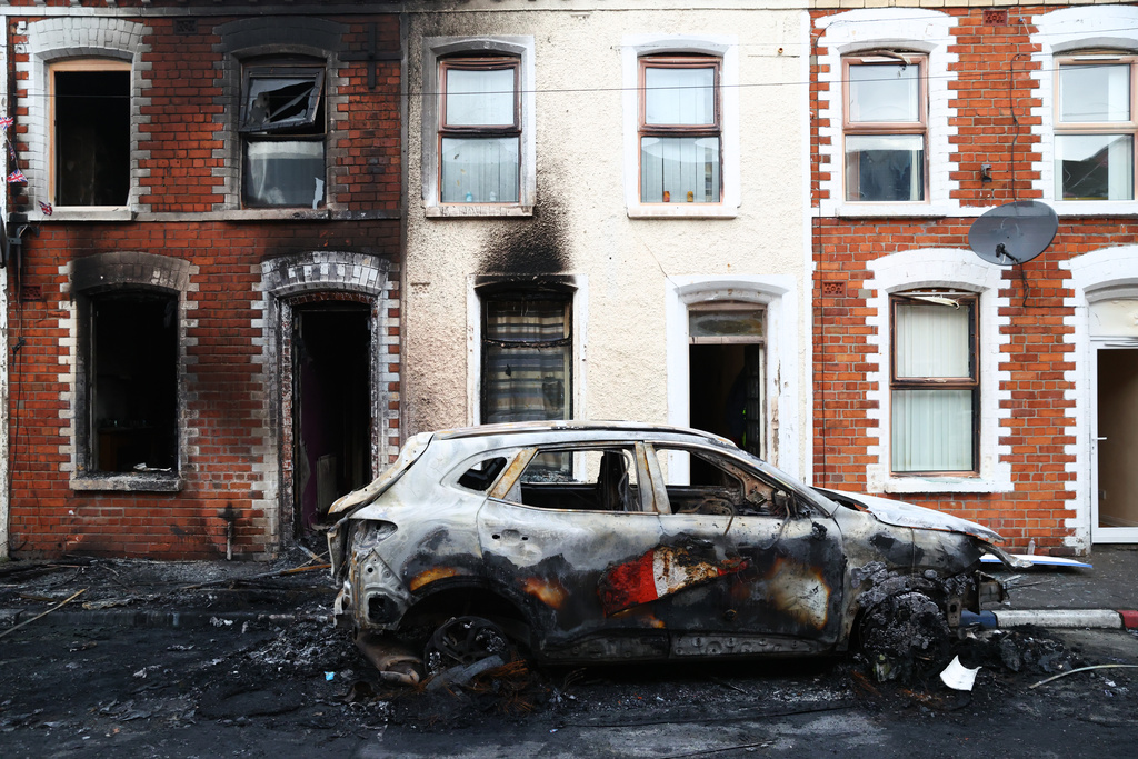 A view of the damage after rioting broke out late Tuesday, in east Belfast, Northern Ireland, Wednesday, June 10, 2026, following a stabbing incident. (AP Photo/Peter Morrison)