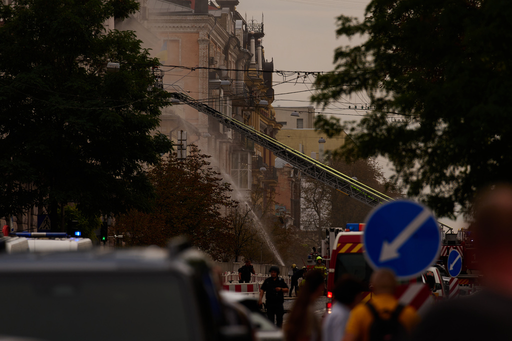 Firefighters work to extinguish a fire after a Russian drone attack struck a building in downtown Kyiv, Ukraine, Friday, Sept. 4, 2026. (AP Photo/Francisco Seco)