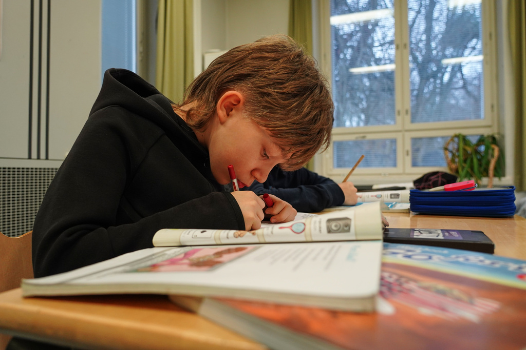 Ten-year-old fourth grade student Ilo Lindgren works during a media literacy class at Tapanila Primary School in Tapanila, Finland, on Dec. 9, 2025. (AP Photo/James Brooks)