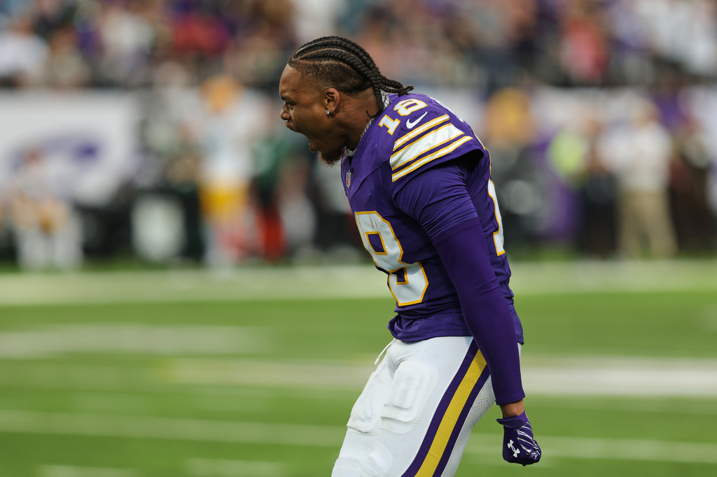 Minnesota Vikings wide receiver Justin Jefferson celebrates a defensive stop against the Green Bay Packers as he watches from the sideline during the second half of an NFL football game, Sunday, Sept. 13, 2026, in Minneapolis, Minn. (AP Photo/Bailey Hillesheim)