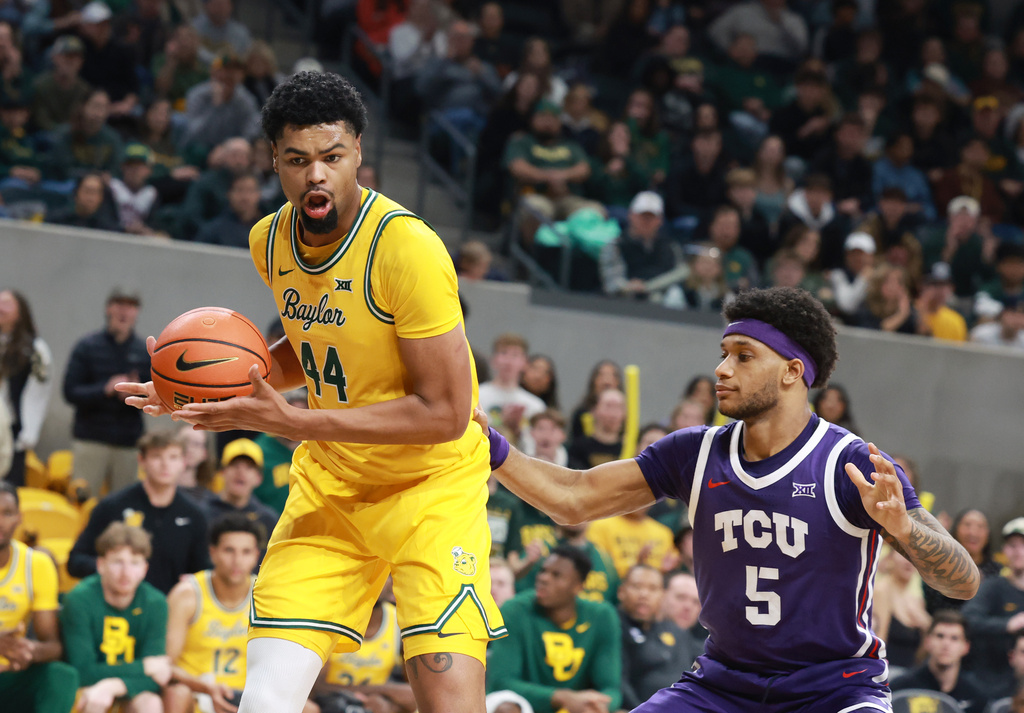 Baylor center Caden Powell pulls down a rebound over TCU forward Micah Robinson in the first half of an NCAA college basketball game, Saturday, Jan. 24, 2026, in Waco, Texas. (Rod Aydelotte/Waco Tribune-Herald, via AP)