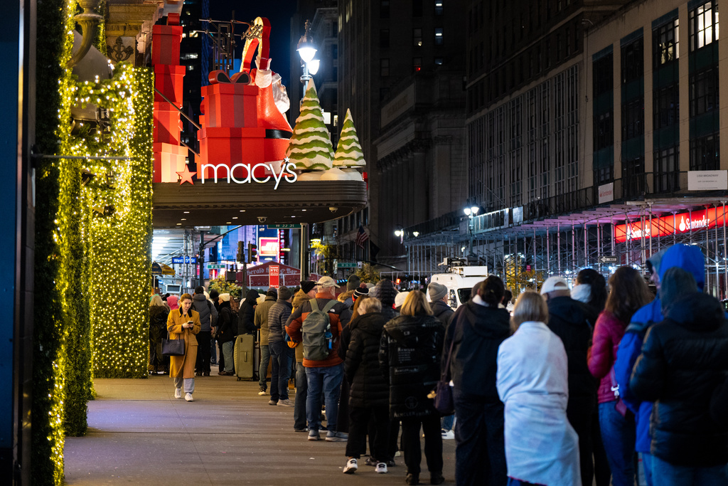 FILE - Black Friday Shoppers wait in line to enter Macy's flagship store on Friday, Nov. 28, 2025. (Photo by Angelina Katsanis/AFP)