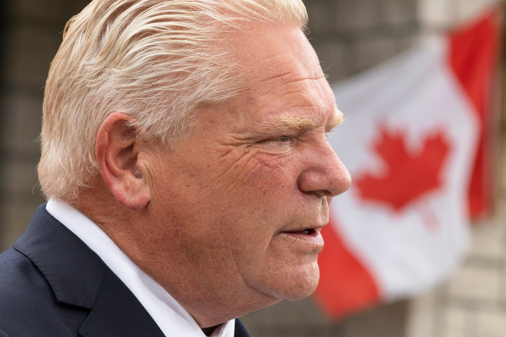 Ontario Premier Doug Ford speaks to media at a housing development in Hamilton, on Monday, Aug. 24, 2026. (Nick Iwanyshyn/The Canadian Press via AP)