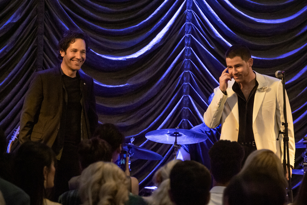 This image released by Lionsgate shows Paul Rudd, left, and Nick Jonas in a scene from "Power Ballad." (David Cleary/Lionsgate via AP)