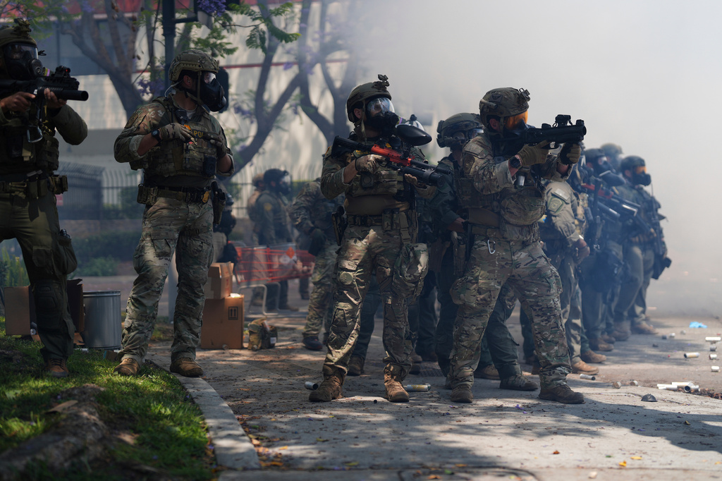 FILE - Law enforcement respond to protesters after federal immigration authorities conducted operations, June 7, 2025, in Paramount, Calif. (AP Photo/Eric Thayer, File)