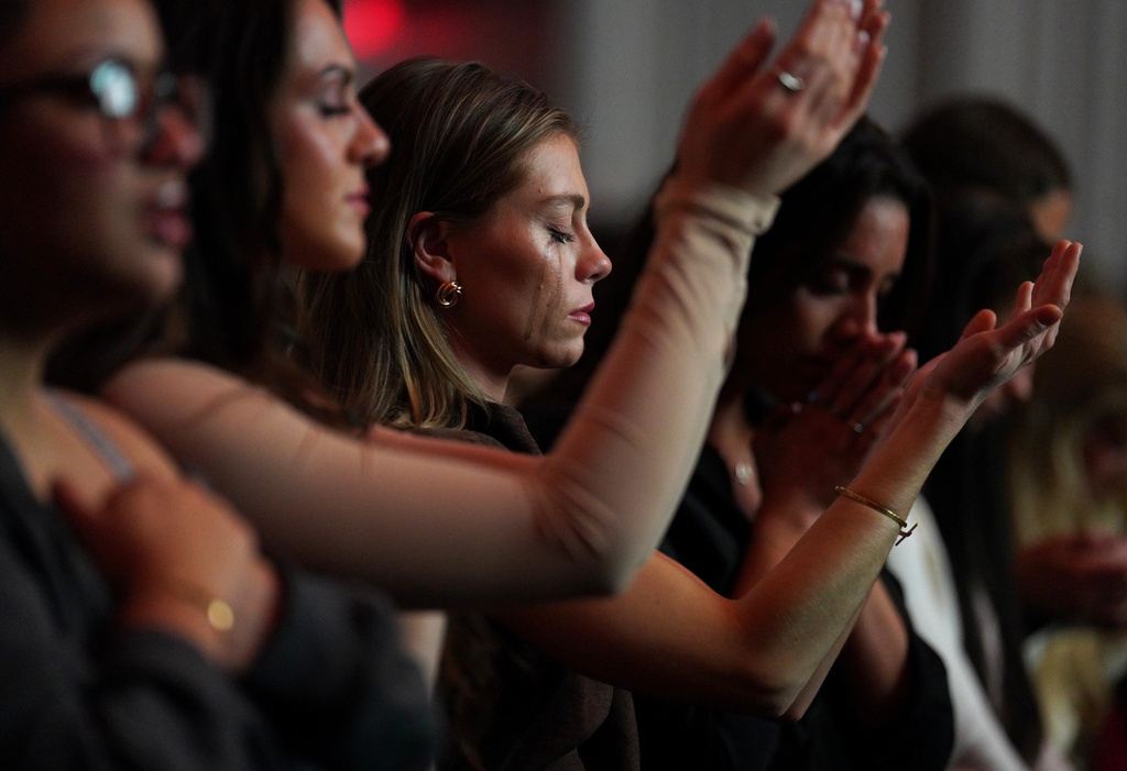 FILE - Followers of the Christian podcast, "Girls Gone Bible," cry during the live show held at the Atlanta Symphony Hall, Nov. 14, 2025, in Atlanta. (AP Photo/Jessie Wardarski, File)