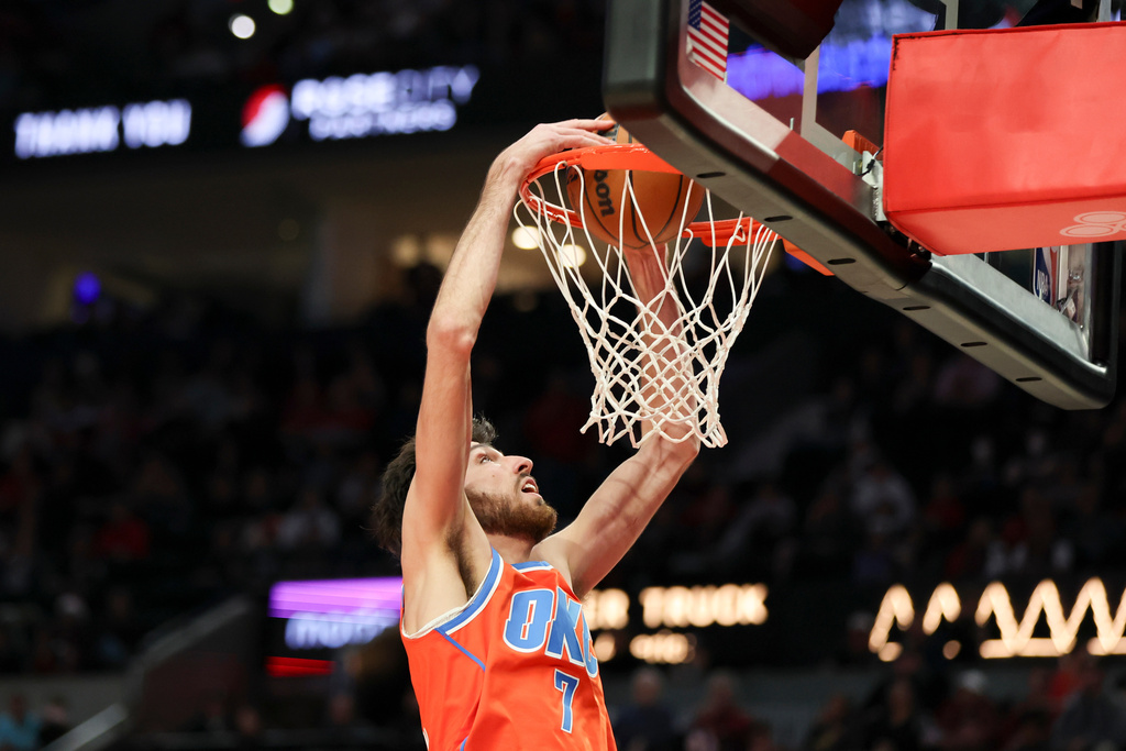 Oklahoma City Thunder center Chet Holmgren drives to the basket against the Portland Trail Blazers during the second half of an NBA basketball game, Sunday, Nov. 30, 2025, in Portland, Ore. (AP Photo/Amanda Loman)