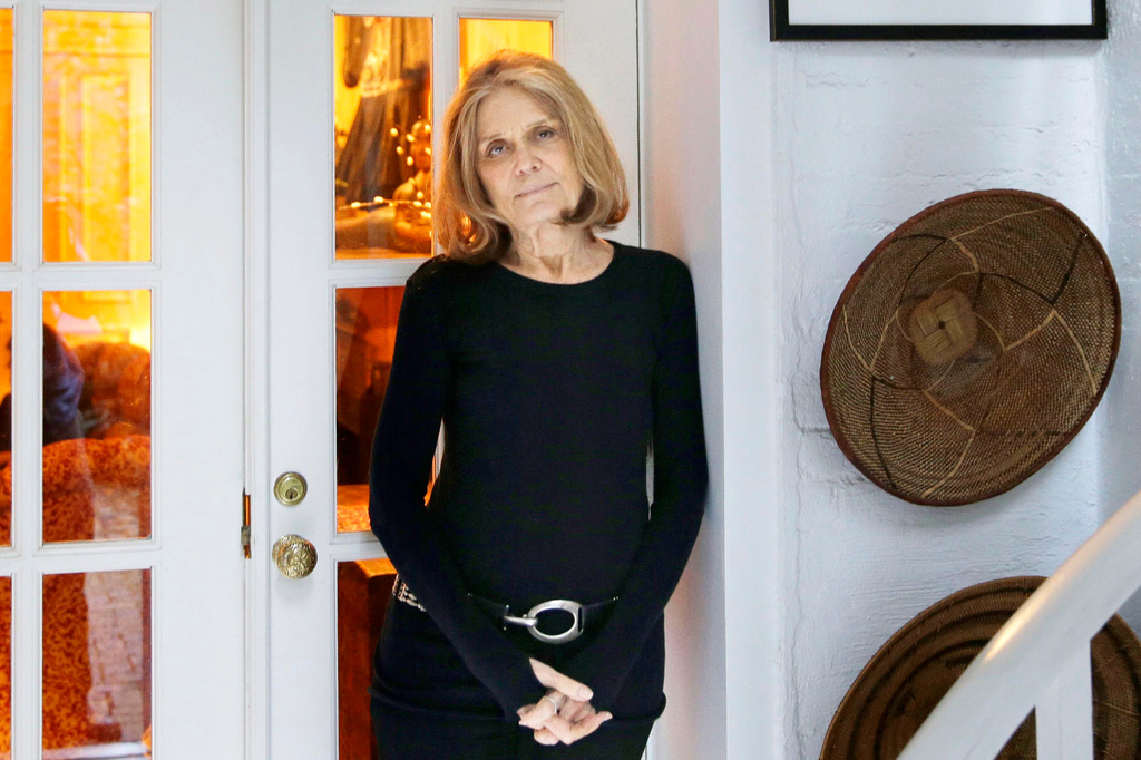FILE - Gloria Steinem poses for a picture at her home in New York on Oct. 19, 2015. (AP Photo/Seth Wenig, File)