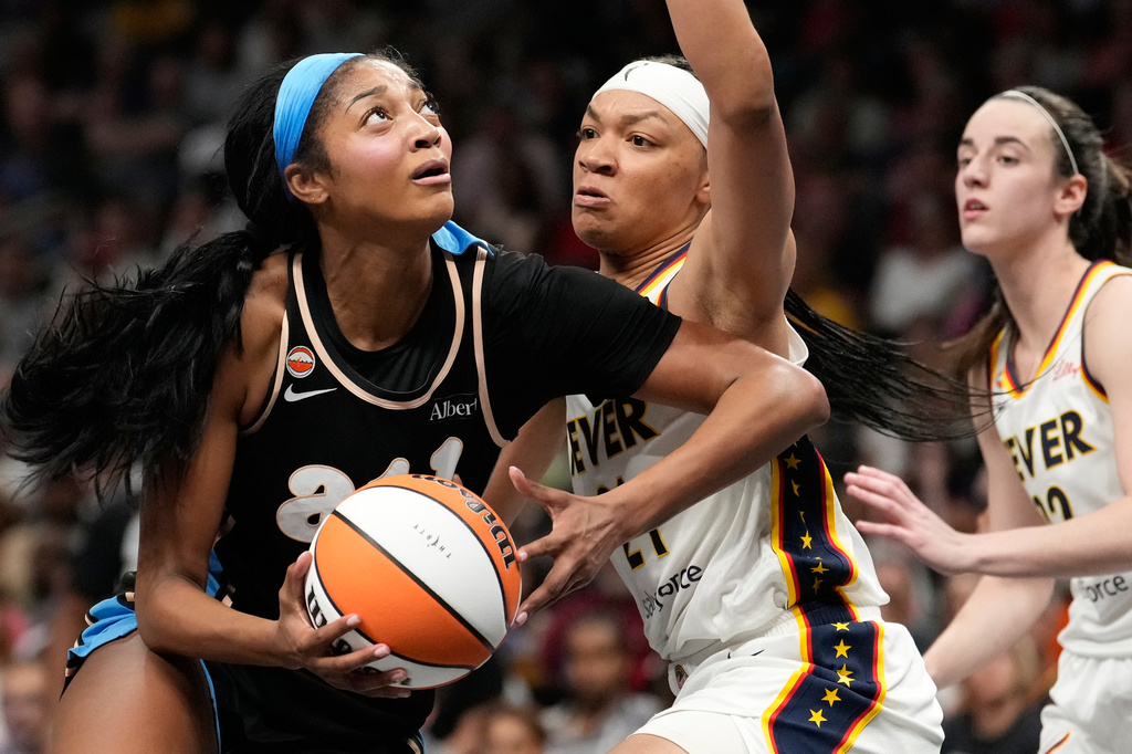 Atlanta Dream forward Angel Reese (5) shoots the ball against Indiana Fever forward Makayla Timpson (21) in the first half of an WNBA basketball game Sunday, Aug. 16, 2026, in Atlanta. (AP Photo/Brynn Anderson)