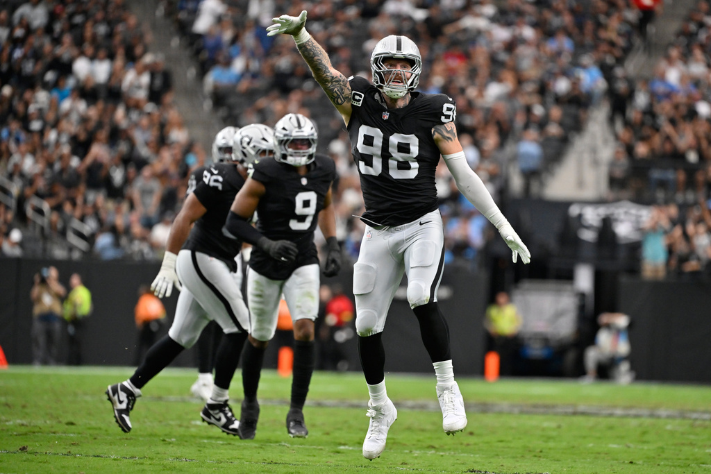Las Vegas Raiders defensive end Maxx Crosby (98) celebrates after sacking Tennessee Titans quarterback Cam Ward during the first half of an NFL football game, Sunday, Oct. 12, 2025, in Las Vegas. (AP Photo/David Becker)